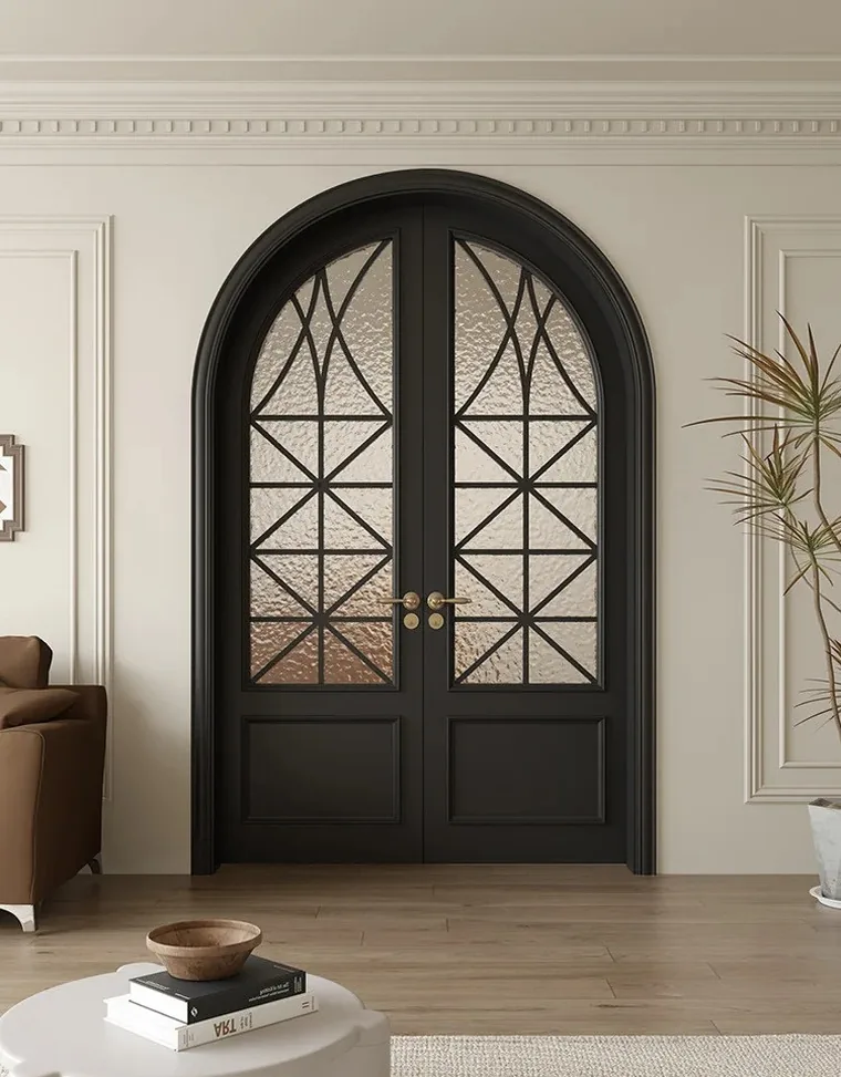 Modern French room with black arched double doors and white moulded walls